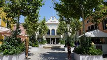 La Roca Village: private Round-Trip Transfer