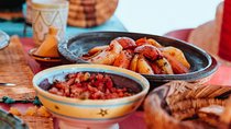 Cook a delicious Tagine, while impacting in Morocco.