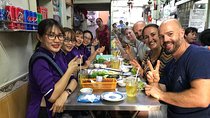 Private Ho Chi Minh Street Food Tour by Motorbike with Ao Dai Female Rider