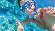 Arch Boat Tour and Snorkeling at Pelican Rock