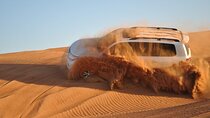 One hour Quad Bike at Red Sand Desert Safari with Camel Ride and BBQ Dinner