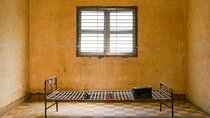 Tuol Sleng Museum and Russian Market Half-day Tour