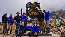 Climb Mt. Meru and 4 hours Game drive Safari.