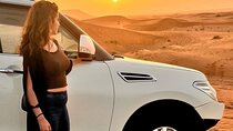 Evening Desert Safari with BBQ Dinner, Sandboarding and Camel Ride Experience