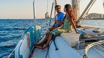 Sunset on a Sailboat along the Coast of Barcelona