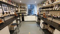 Distill a bottle of gin on mini copper stills