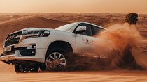 Deluxe Sunset Desert Safari: SandSurfing, Camel Ride & BBQ dinner