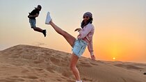  Desert Safari BBQ dinner, Camel ride & sandboarding from Dubai