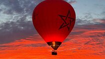 Hot air balloon flight in the desert with camel ride