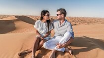 Dubai Red Dune Safari with Camel Ride, Sandboarding & BBQ Dinner