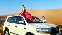 Private Morning Safari Camel Ride, Dune Bashing and Sandboarding