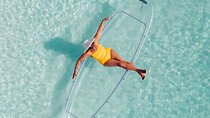 Explore Scenic Water in Transparent Kayak with Drone Footage