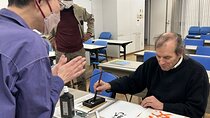 Calligraphy Experience in Tokyo Writing on Colored Paper