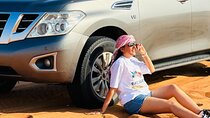 Abu Dhabi Dune Bashing, Sand Surfing, Camel Ride, and BBQ Dinner