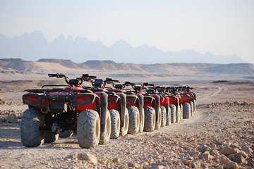 El Gouna Sunset Safari tour by Quad bike, Through The Dry Canyon, and Sand Dunes