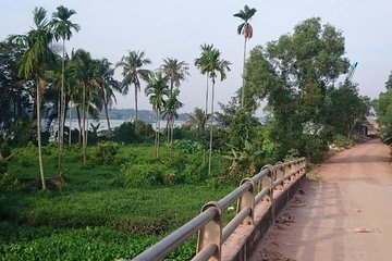 Cycling to CuChi tunnels - single track ride along Saigon river. 