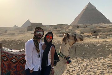 Cairo layover tour Giza pyramids Egyptian museum local bazaars Camel ride Lunch