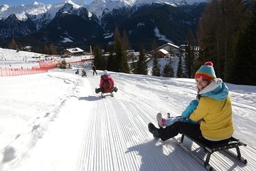 The most famous sledge slope in the Dolomites and a panoramic tour by car