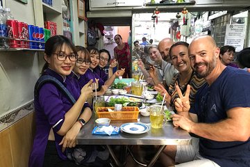 Private Ho Chi Minh Street Food Tour by Motorbike with Ao Dai Female Rider