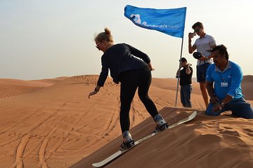 Enjoy The Dubai Fossil Rocks Desert with Sandboarding, Camel Ride,& BBQ Dinner