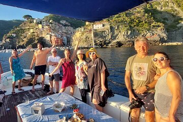 Sunset Cinque Terre Boat Tour with a traditional ligurian gozzo from Monterosso