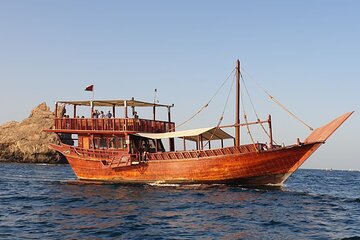 Omani Traditional Dhow Cruise: Sunset and Muscat Coastal View