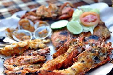 Romantic Seafood Dinner under sunset jimbaran Beach