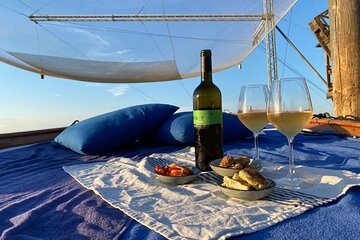 Aperitif at sunset in the Venice lagoon on a private boat.