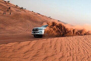 Evening Desert Adventure: Quad Biking, Sandboarding & Camel Ride