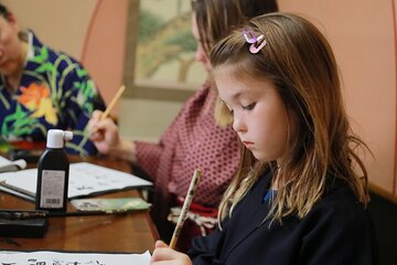 Learning Zen of Japanese Calligraphy in kimono near Osaka Castle