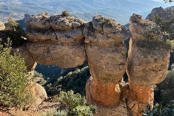 From Barcelona: Hiking in the mountain with caves, cliffs