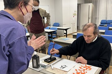 Calligraphy Experience in Tokyo Writing on Colored Paper