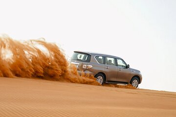 Premium Red Dunes Desert Safari with Camel Ride and BBQ Dinner