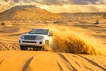 Doha: Sunset Desert Safari with Sand Boarding and Camel Ride 
