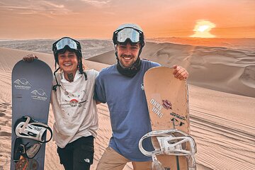 Sandboarding or Sandsky with sunset in Huacachina