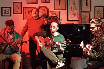 Live Fado Show with Traditional Dinner and Lisbon by Night 