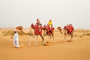 Sunset Camel Trek with Sandboarding and Lavish BBQ Dinner Buffet